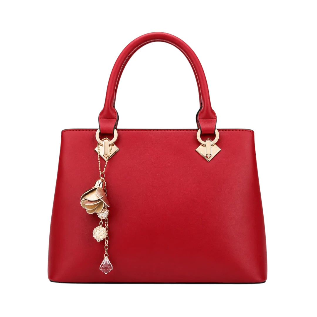 Mbela Scarlet Leather Handbag with Elegant Gold Floral Charm